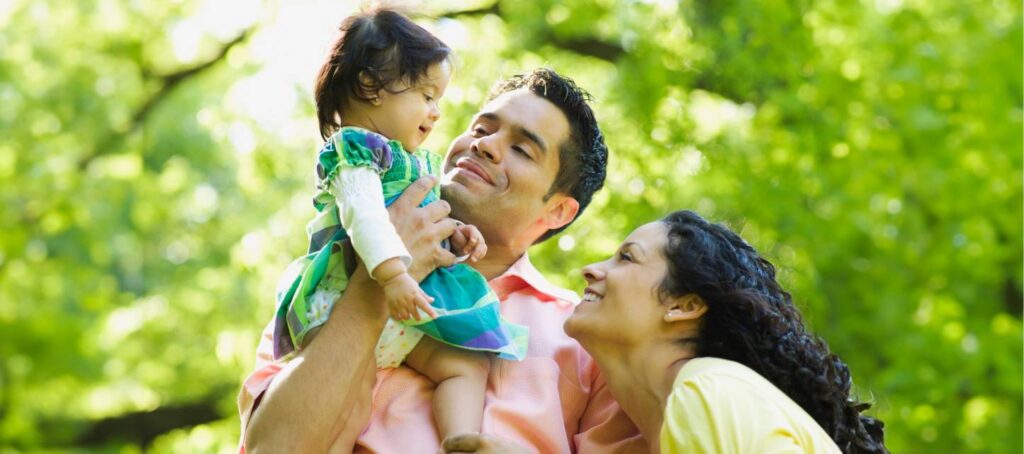 parents smiling at baby
